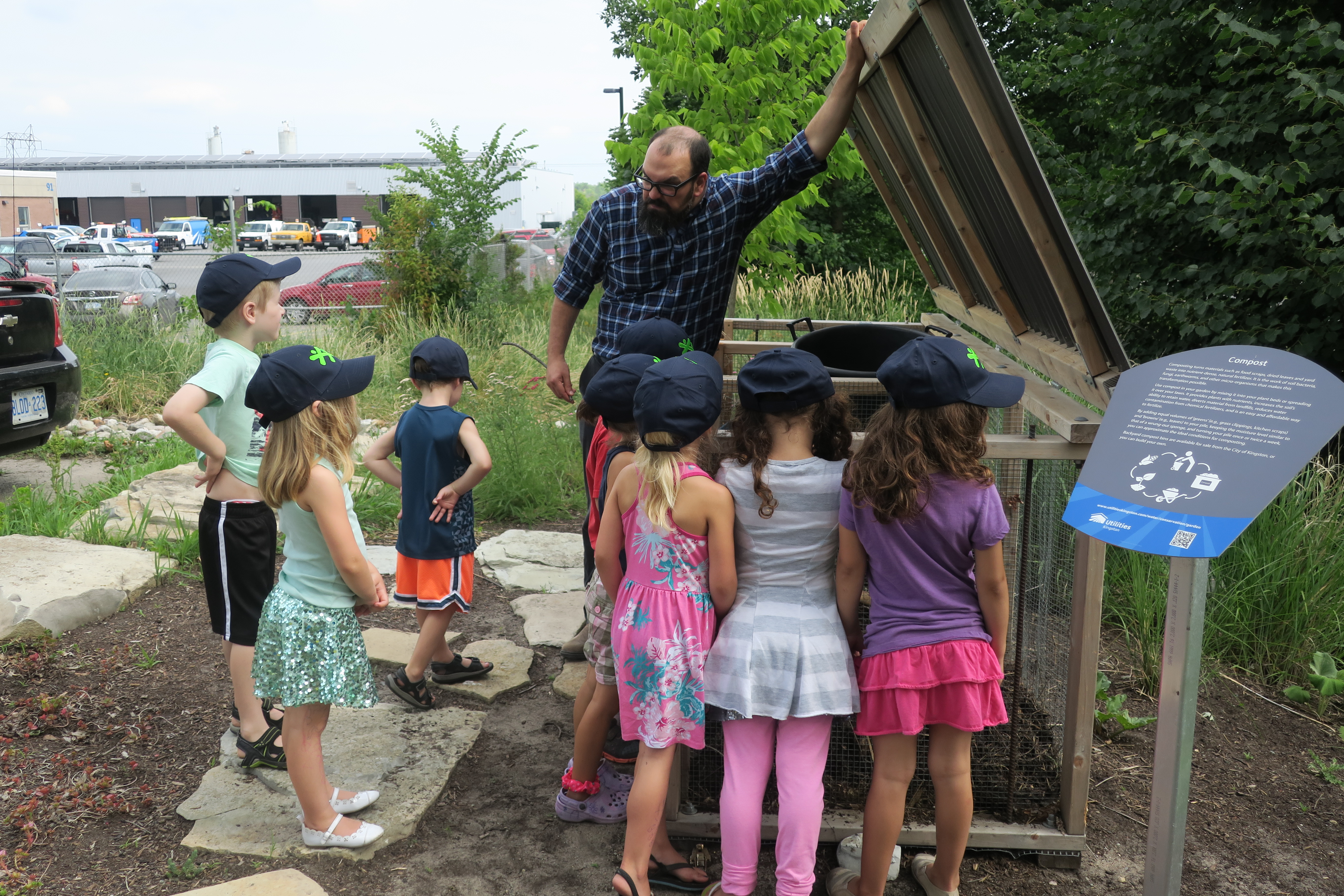 Children participating in a guided tour of the water conservation garden