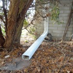 downspout leading away from house foundation