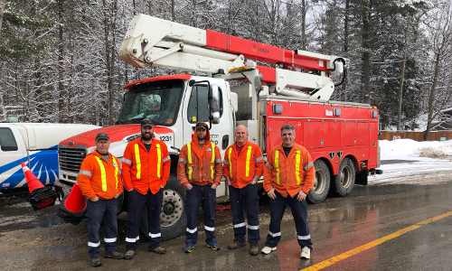 Utilities Kingston crew members in line at the Canada-US border. From left to right, Allan Hawley, William Beattie, Kyle Barrett, Sheldon Waterman, and Chris Mills.